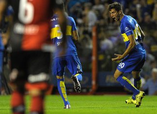 Boca's footballer Rodrigo Bentancur (R) celebrates with teammates after scoring against Newells during their Argentina First Division football match at La Bombonera stadium, in Buenos Aires, Argentina, on February 20, 2016. AFP PHOTO / ALEJANDRO PAGNI / AFP / ALEJANDRO PAGNI (Photo credit should read ALEJANDRO PAGNI/AFP/Getty Images)
