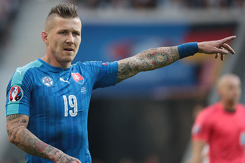 Slovakia's midfielder Juraj Kucka reacts during the Euro 2016 round of 16 football match between Germany and Slovakia at the Pierre-Mauroy stadium in Villeneuve-d'Ascq near Lille on June 26, 2016. / AFP / KENZO TRIBOUILLARD (Photo credit should read KENZO TRIBOUILLARD/AFP/Getty Images)